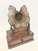 A Regency rosewood and mother of pearl inlaid watch stand, height 20cm.