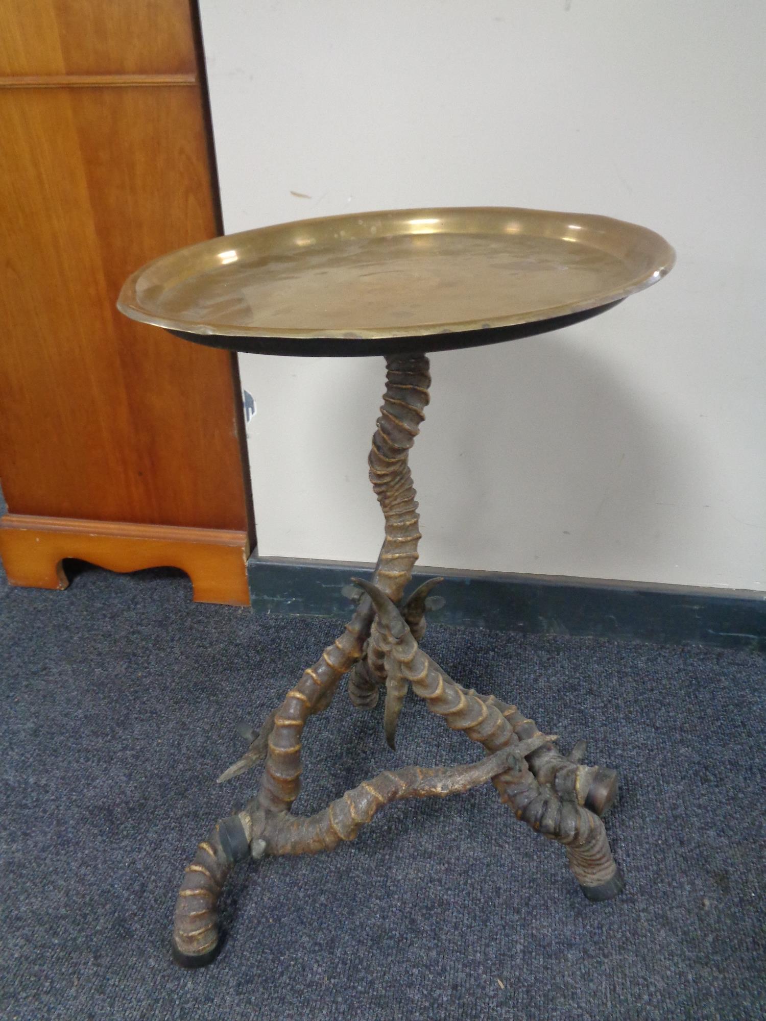 A Blackbuck horn brass topped occasional table