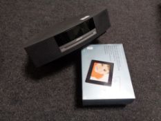A John Lewis 7 inch multimedia digital photo frame and a Bose Wave music system (Model AWRCC5)