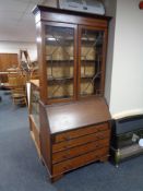 A 19th century inlaid mahogany bureau bookcase with astragal glazed doors.