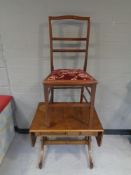 An Edwardian mahogany bedroom chair together with a sofa coffee table, fitted two drawers.