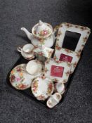 A tray of fourteen pieces of Royal Albert Old Country Roses china to include mantel clock,