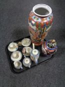 A tray of oriental wares including lidded vases, pair of decorative eggs on wooden stand,