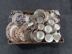 A box of two antique china tea services and a teapot