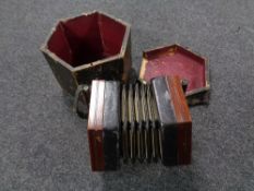 An early 20th century concertina squeeze box labelled Lachenal & Co, fitted case a/f.