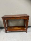 A contemporary hardwood hall table fitted a drawer