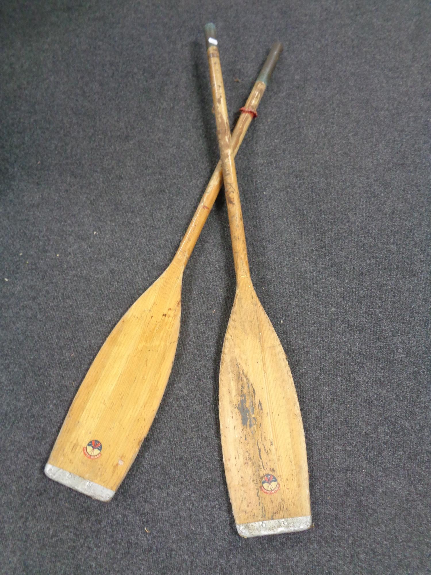 A pair of 20th century Kober wooden paddles.