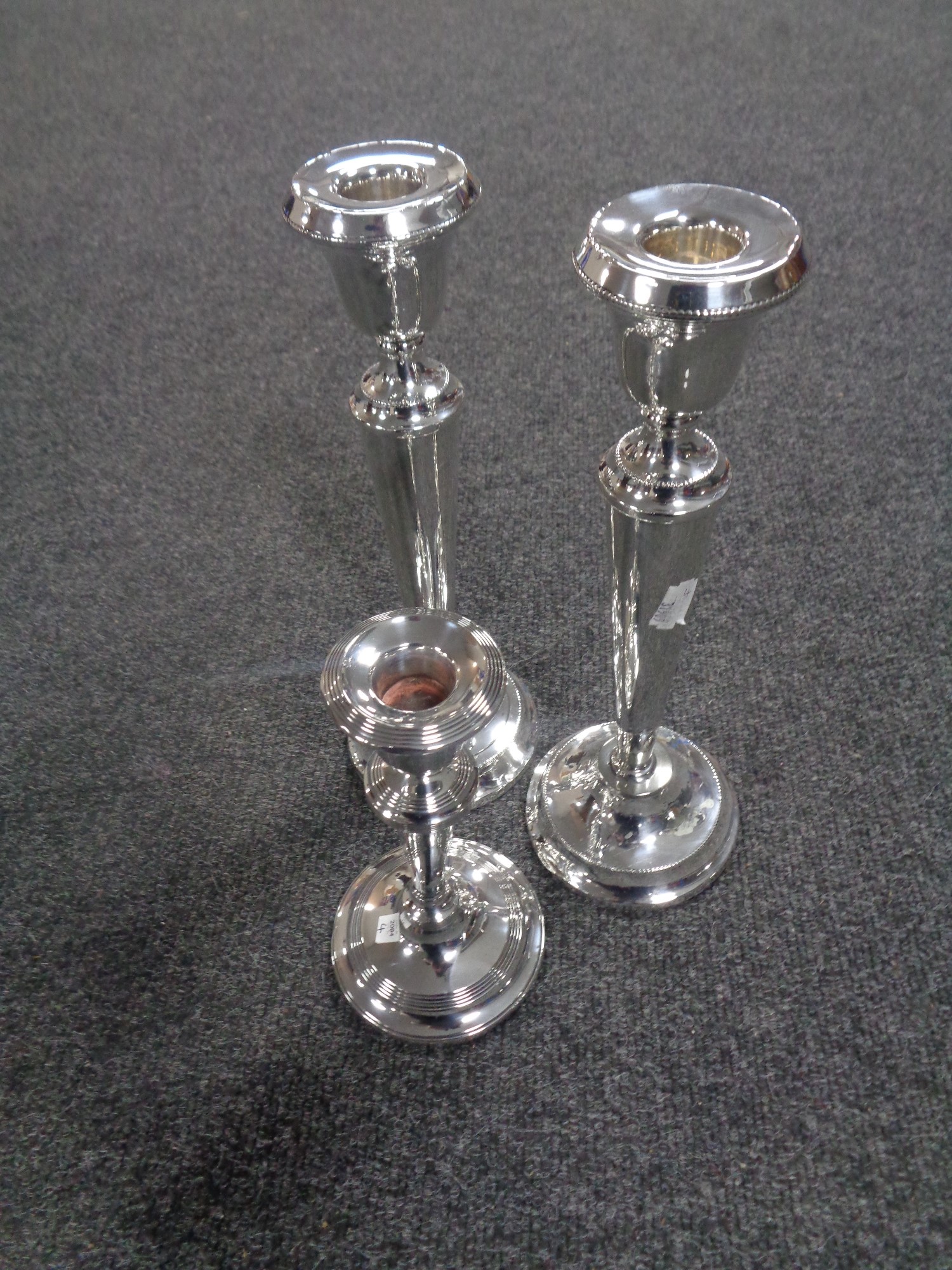 A pair of silver tapered stem candlesticks, height 29 cm,