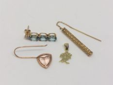 A single gold earring set with blue topaz, another set with pink topaz and two 9ct gold items.