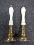 Two vintage brass and ceramic beer pump handles.