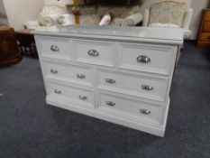 A painted pine glass top seven drawer chest.