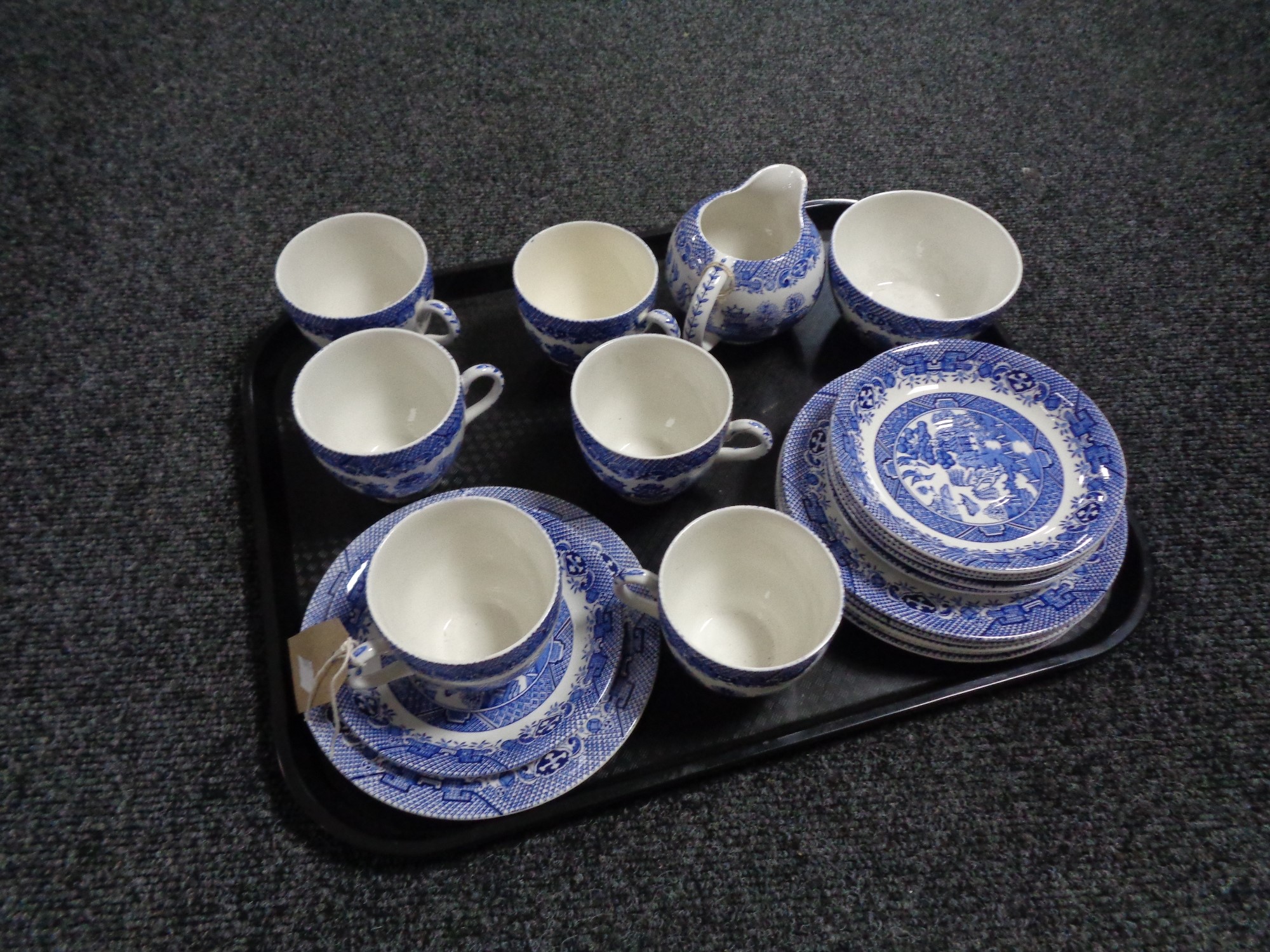 A tray of twenty piece Staffordshire willow pattern tea service