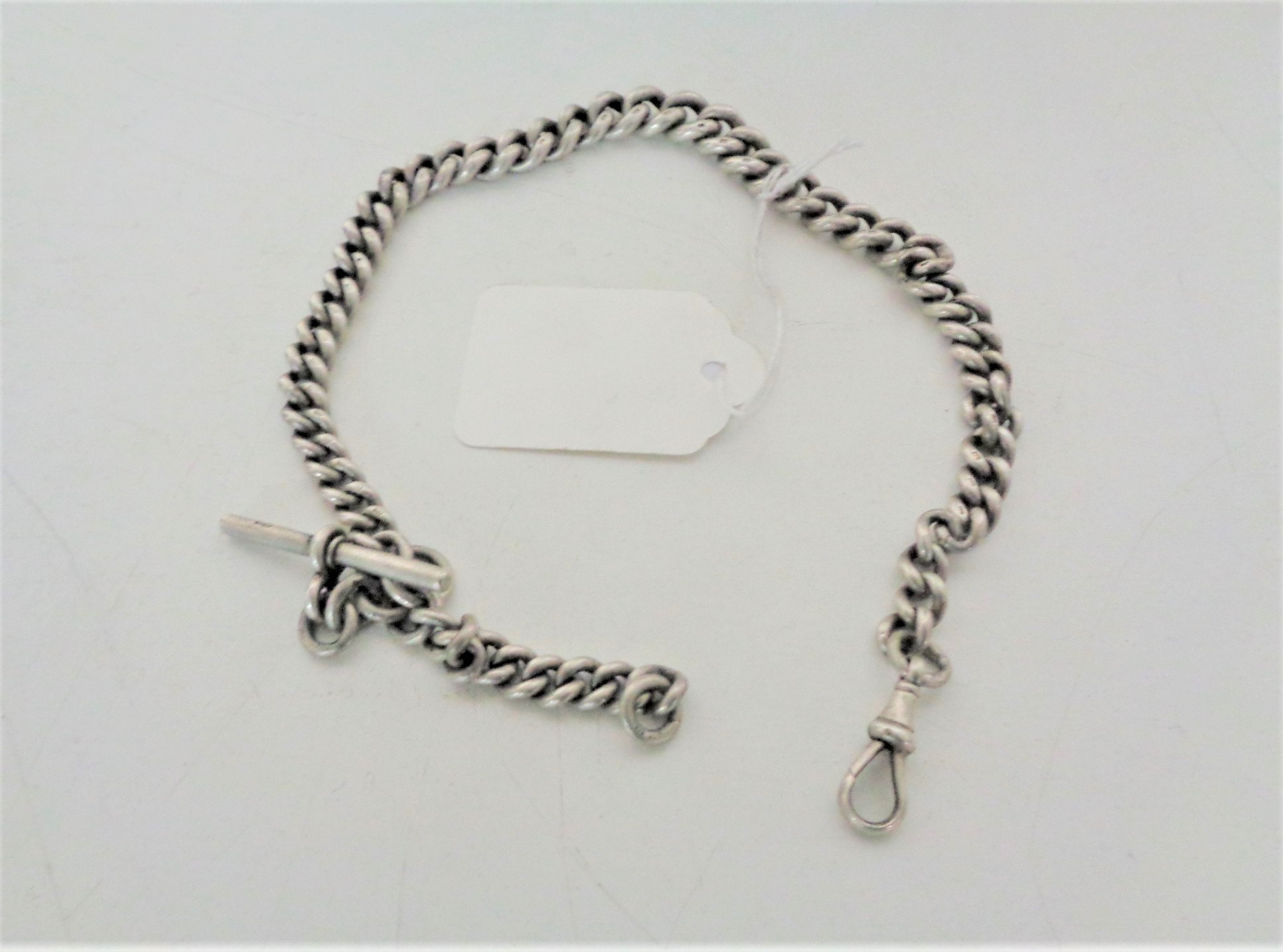 A silver graduated pocket watch chain with T-bar, length 36 cm, 68.4g.