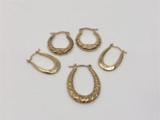 Two pairs of 9ct gold hoop earrings and another single. CONDITION REPORT: 2.