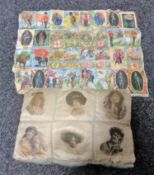 An embroidery of antique cigarette silks depicting military figures etc together with a Victorian