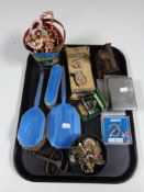 A tray containing costume jewellery, three piece Art Deco dressing table brush set,