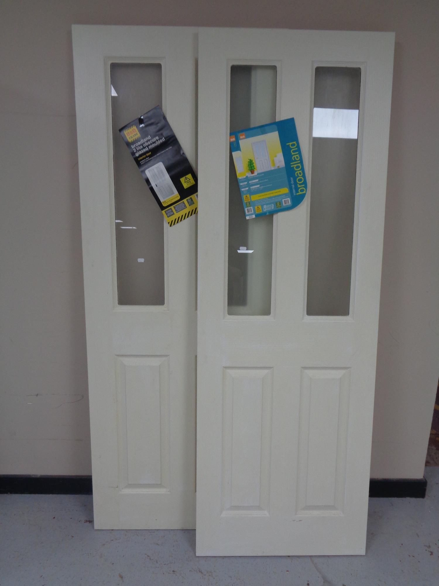 Two laminated interior doors with glazed panels.