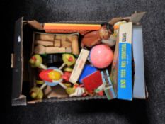 A box containing vintage toys to include Ring Toss and shooting game, wooden blocks,