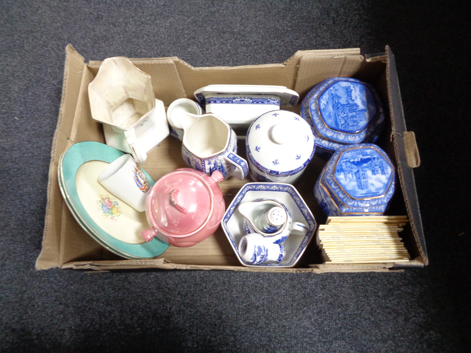 A box containing Ringtons and Maling china, commemorative mug, Mr Men books.