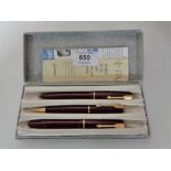 A cased three piece Parker pen set, fountain pen with 14ct gold nib.