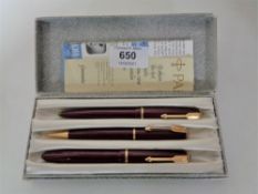 A cased three piece Parker pen set, fountain pen with 14ct gold nib.