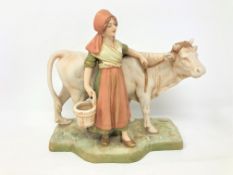 A Royal Dux figure - Lady leading a cow, height 18 cm.