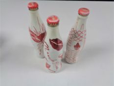 Three 330 ml designer Coca Cola bottles by Del Marquis Manolo Blahnik & Trevor Nelson