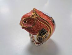 A Royal Crown Derby paperweight of a squirrel