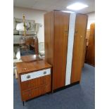 A mid 20th century double door wardrobe and matching three drawer dressing chest with a melamine