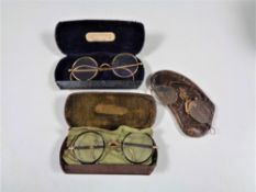 Three pairs of cased antique gilt rimmed glasses.