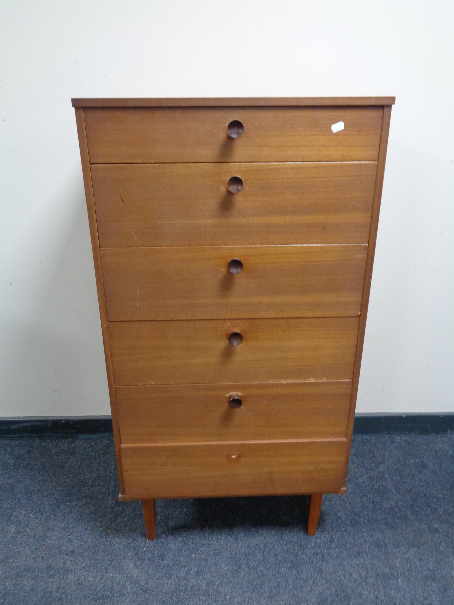 A mid 20th century teak six drawer chest.