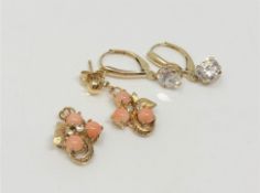 A pair of 9ct gold coral and diamond earrings (one lacks fitting),