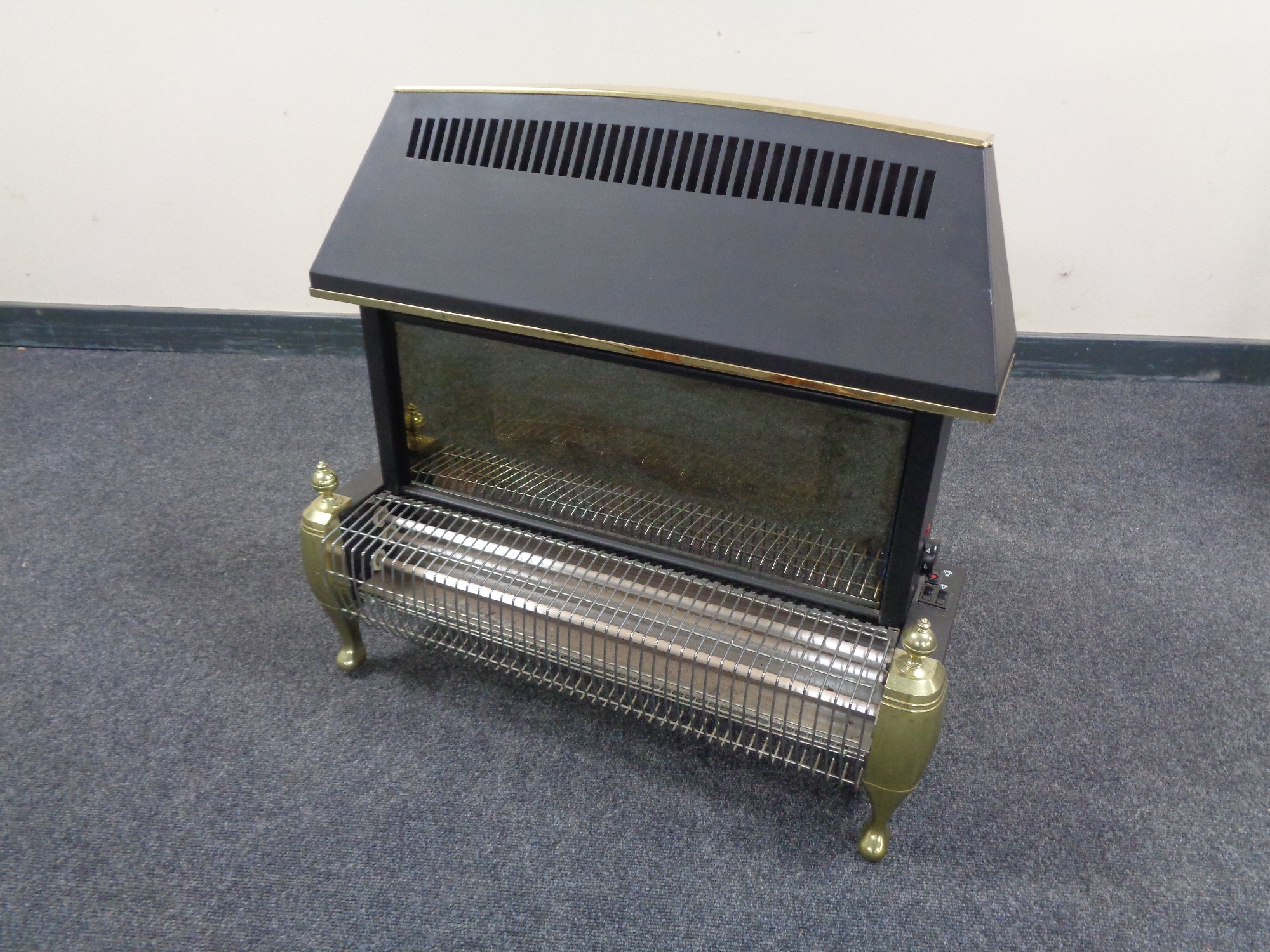A metal and brass electric fire.