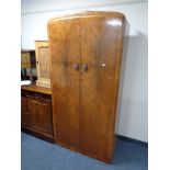 A 1930s walnut double door gentleman's wardrobe.