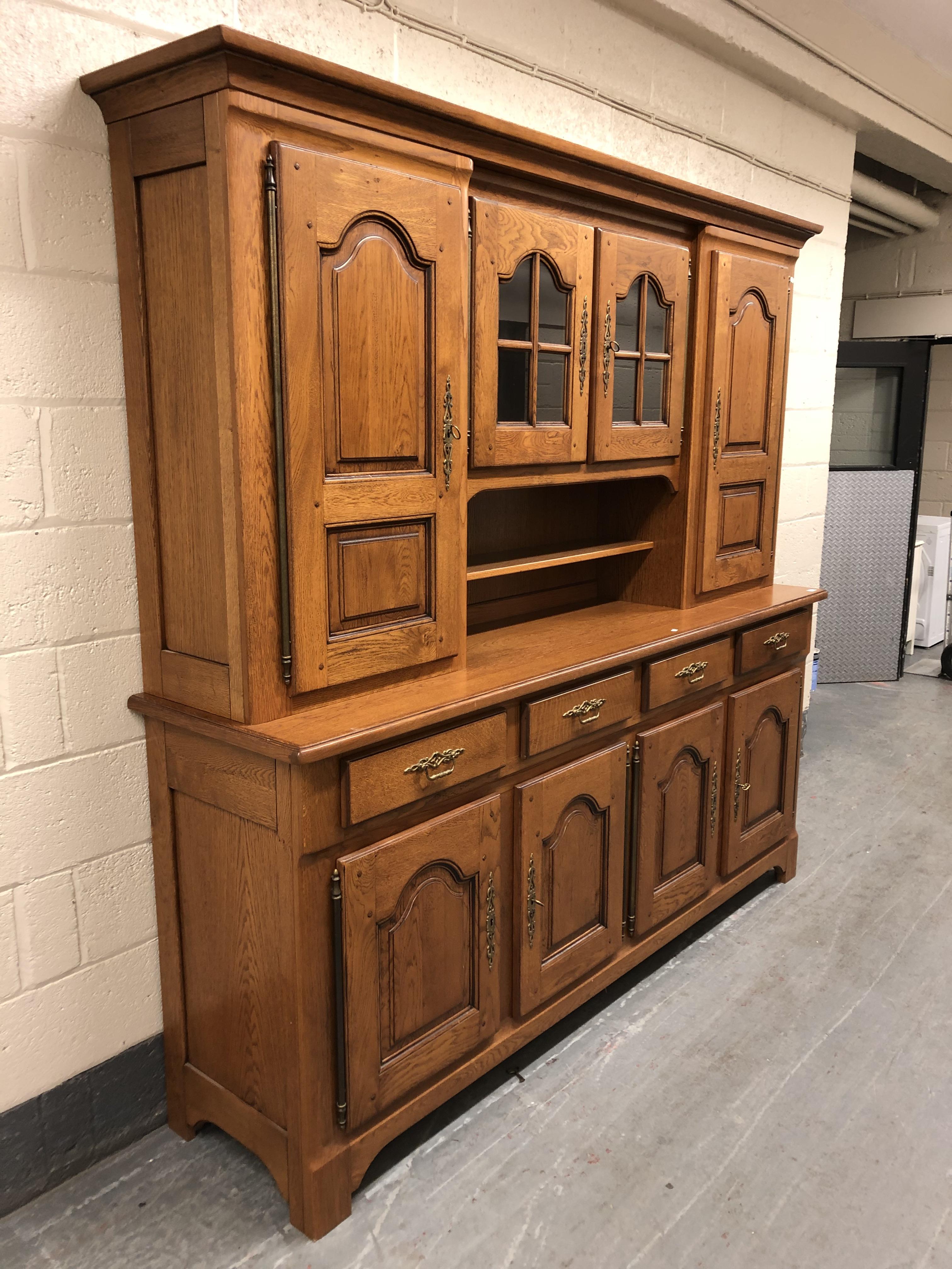 A 20th century oak dresser fitted eight cupboards and four drawers with brass bow handles, - Image 4 of 4