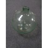 An antique glass carboy.