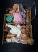 Two boxes containing a quantity of assorted plastic dolls, soft toys, doll accessories etc.