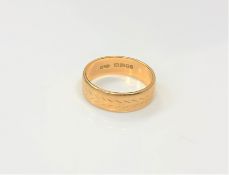 An 18ct gold band ring, size J CONDITION REPORT: 3.