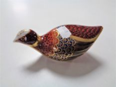 A Royal Crown Derby paperweight of a partridge with gold stopper