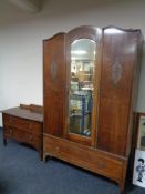 A 1930s oak mirror door wardrobe, fitted drawer beneath, together with two drawer chest.