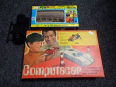 A boxed mid 20th century Mettoy Computacar and a Fortuna battery operated plastic toy projector