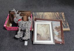 A box containing wicker reindeer with lights, wooden photo frames, wireless keyboards in case,