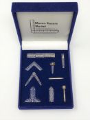 A Masonic enamelled lapel set in fitted box.