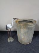 A vintage galvanized wash tub together with a cast metal garden figure of a heron