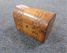 A Victorian marquetry inlaid domed topped tea caddy