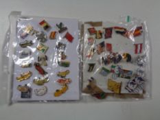 A collection of assorted pin badges to include motor cars, world flags etc.