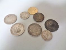 Nine antique and later coins to include 1923 silver dollar, 1943 half dollar,