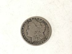 An 1897 silver dollar.