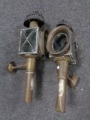 A pair of antique brass coach lamps.