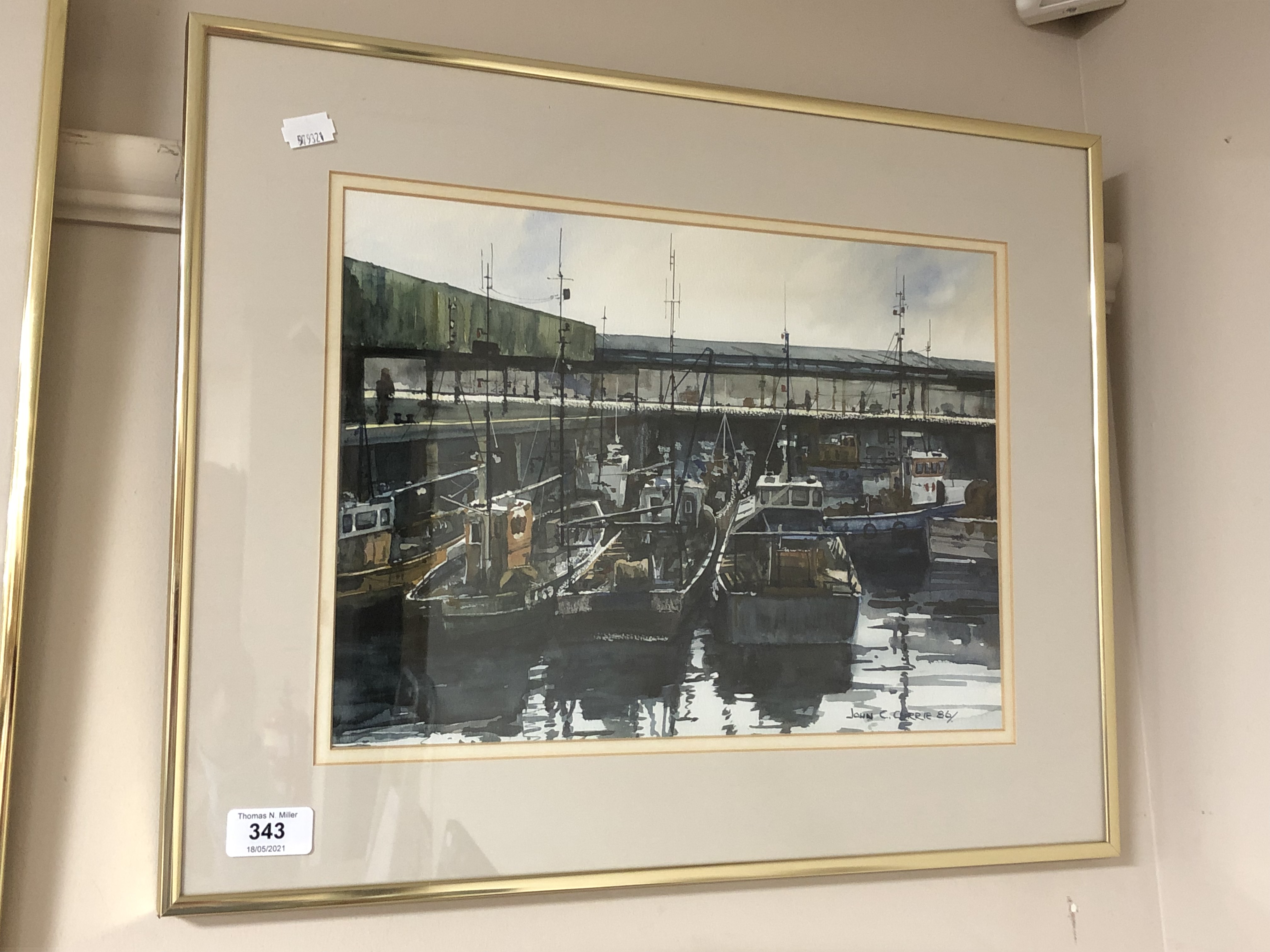 John C. Currie, Boats at North Shields, watercolour, in a brass frame.